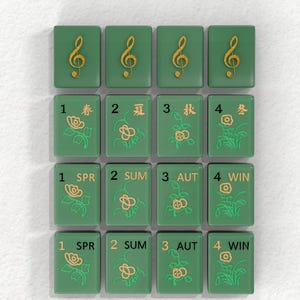 a collection of green tiles with musical notes and flowers on them, arranged in a grid pattern.