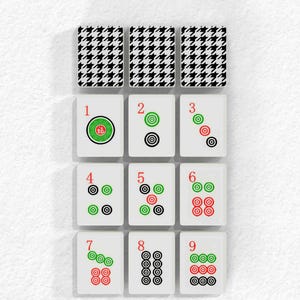 The image is a collage of nine tiles, each with a unique pattern and color scheme. The tiles are arranged in a grid format, with three tiles on the top row, three on the middle row, and three on the bottom row. The tiles feature a combination of black, white, green, and red colors, creating a visually striking and diverse display.