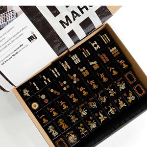 a box containing a set of mahjong tiles, with the text "Mahjong Set Only" visible.