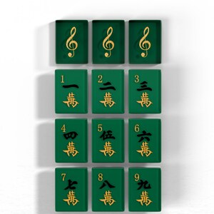 a collection of green tiles with gold musical notes and numbers, arranged in a grid pattern.