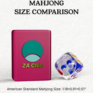 The image is a comparison of the size of a Mah Jong Club card and a dice. The card is pink and has a green and blue logo, while the dice is clear and has a blue and white pattern. The text above the card and the dice states "Mahjong Size Comparison" and "American Standard Mahjong Size: 1.18*0.91*0.51*", indicating the size comparison between the card and the dice.