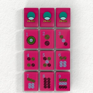 a collection of pink tiles with various designs and numbers, arranged in a grid-like pattern.