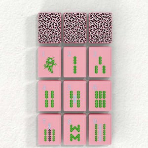 a collection of pink tiles with various patterns and designs, including leopard print and floral patterns.