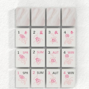 a collection of tiles, each with a different flower design and number, arranged in a grid pattern.