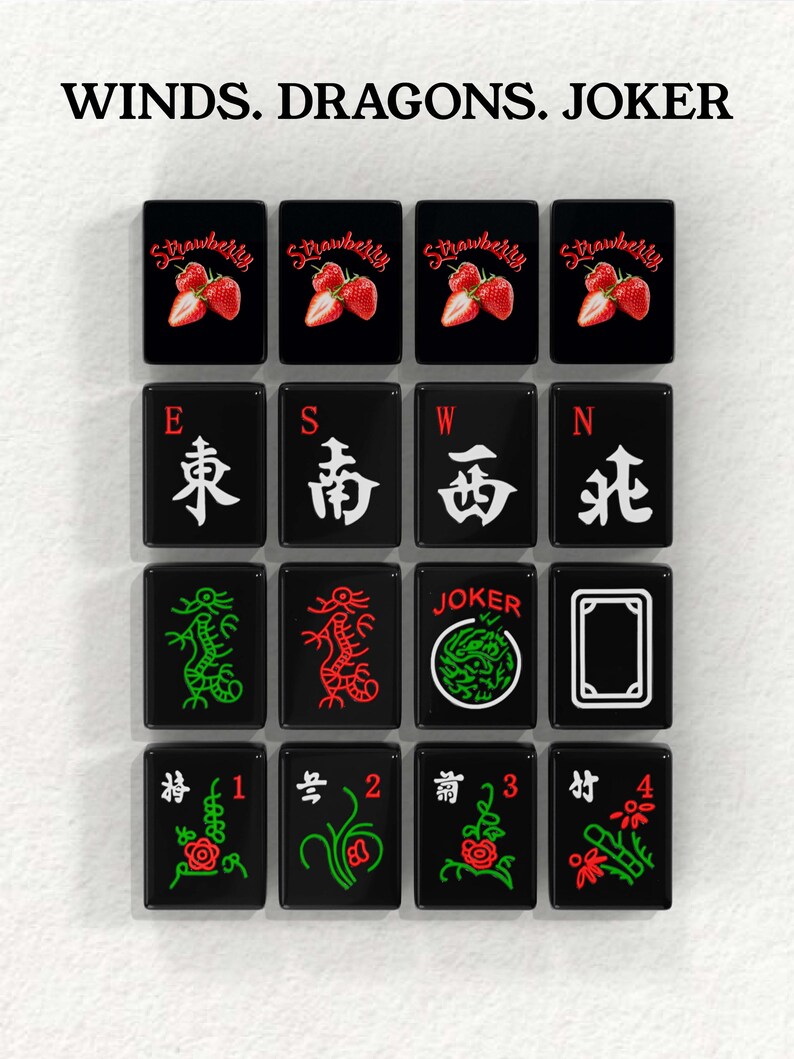 a collection of black and white tiles with various symbols and text, including images of strawberries, dragons, and the word "JOKER".