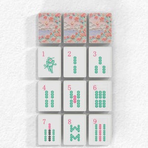 a collection of tiles with various floral designs, arranged in a grid pattern.