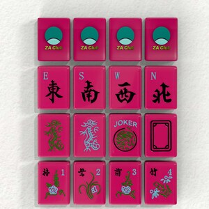 a collection of pink tiles with various symbols and text, including Chinese characters, a dragon, and the words "JOKER" and "ZA Club".