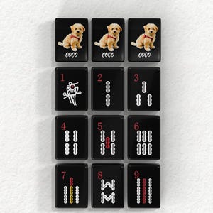 a collection of black tiles with various images and numbers on them, arranged in a grid-like pattern.