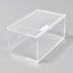 A clear, rectangular storage box with a transparent interior.