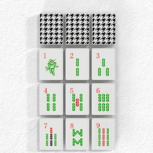 a set of four white and green dices