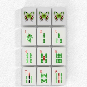a collection of tiles arranged in a grid, each featuring a unique design or pattern. The tiles are white and display various shapes and symbols, including butterflies, numbers, and other abstract elements. The tiles are organized in a grid format, with three rows and four columns, creating a visually appealing and intricate arrangement.