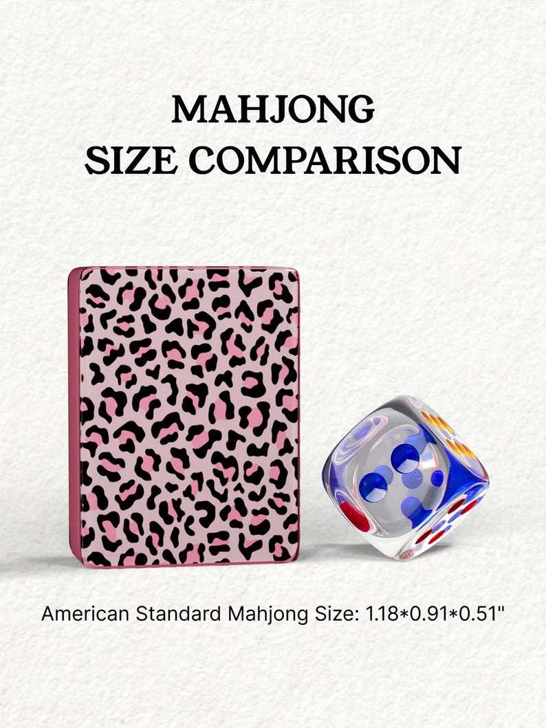 a pink leopard print object and a clear glass dice, both placed on a white background.