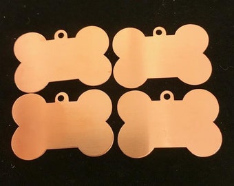 FOUR dog bone dog tags 1"h x 1 5/8" 24 gauge