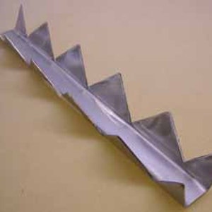 May include: A silver metal strip with a series of triangular teeth along one edge. The strip is about 12 inches long and has a slight curve.