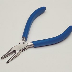 May include: Needle-nose pliers with a silver metal head and blue rubber handles. The pliers are designed for precision work, featuring long, tapered jaws. The blue handles provide a comfortable grip for detailed tasks.