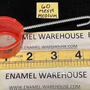 May include: A red plastic strainer with a metal mesh filter and a silver wire handle. The strainer is labeled "60" and "Medium".