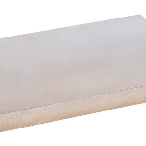 May include: A rectangular, solid metal block with a brushed, silver finish. The block is a uniform thickness and has a smooth, reflective surface. The edges are clean and sharp, suggesting a precision-made item. The object is isolated on a white background.