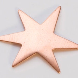 May include: A copper-colored, five-pointed star charm with a smooth, slightly textured surface.