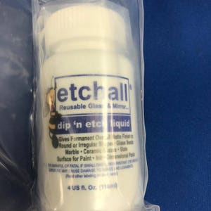May include: A white plastic bottle with a blue and white label that reads "etchall Reusable Glass & Mirror... dip 'n etch liquid". The label also includes instructions for use and warnings. The bottle contains 4 US fluid ounces (118 ml) of liquid.