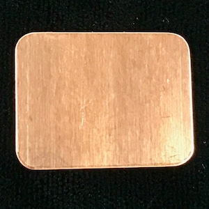 May include: A rectangular piece of copper sheet metal with a brushed finish.