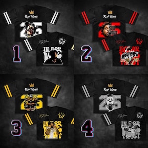 May include: Black jersey-style shirts with various graphics and text. Each shirt features the text "Rod Wave" and a number, along with other designs. The shirts have different color accents, including white, red, and yellow.