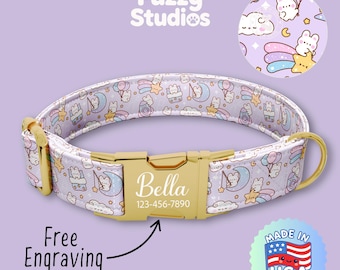 May include: A light purple dog collar with a gold-colored buckle. The collar features a repeating pattern of cartoon bears, moons, and stars. The buckle is engraved with the name "Bella" and a phone number. The text "Free Engraving" is also visible.