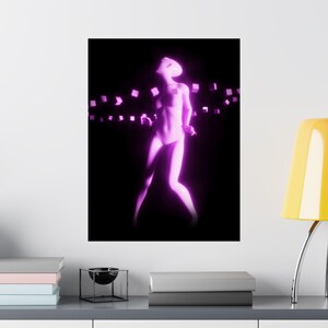 May include: A poster featuring a digitally rendered figure in a dynamic pose, illuminated with a vibrant pink glow against a black backdrop. The figure is surrounded by floating, glowing cubes, creating a futuristic aesthetic.