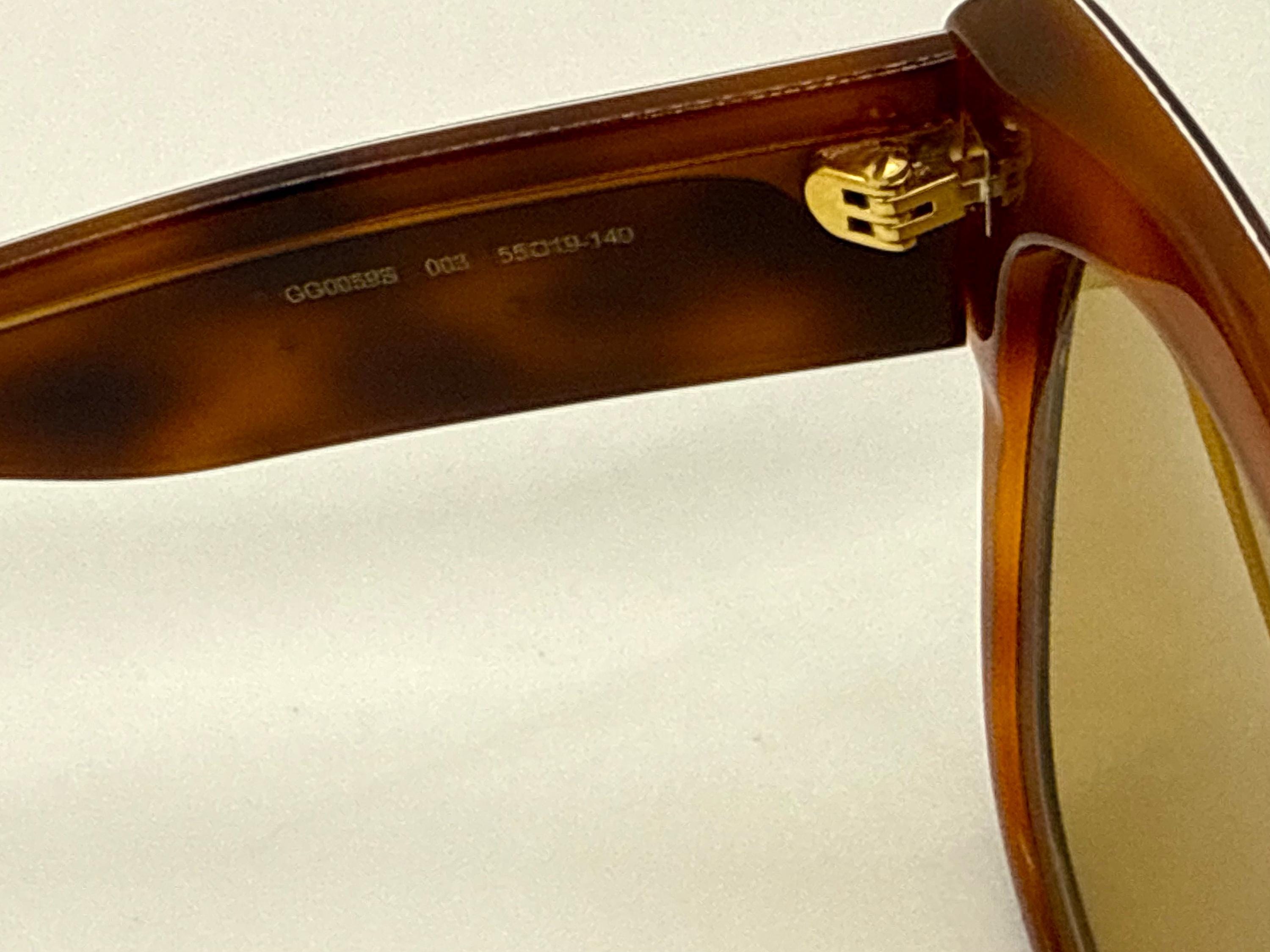 Gucci GG0059S 003 Cat Eye Sunglasses Tortoise Stripe Studded Arms Gucci Gg0059s 003 Amber Tortoise Geometric Sunglasses W  main image 3