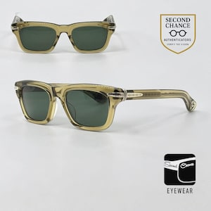May include: Translucent olive-green sunglasses with dark green lenses and silver-tone metal accents on the temples and hinges. The frames feature a rectangular shape. The image includes a logo with the text SECOND CHANCE AUTHENTICATORS.