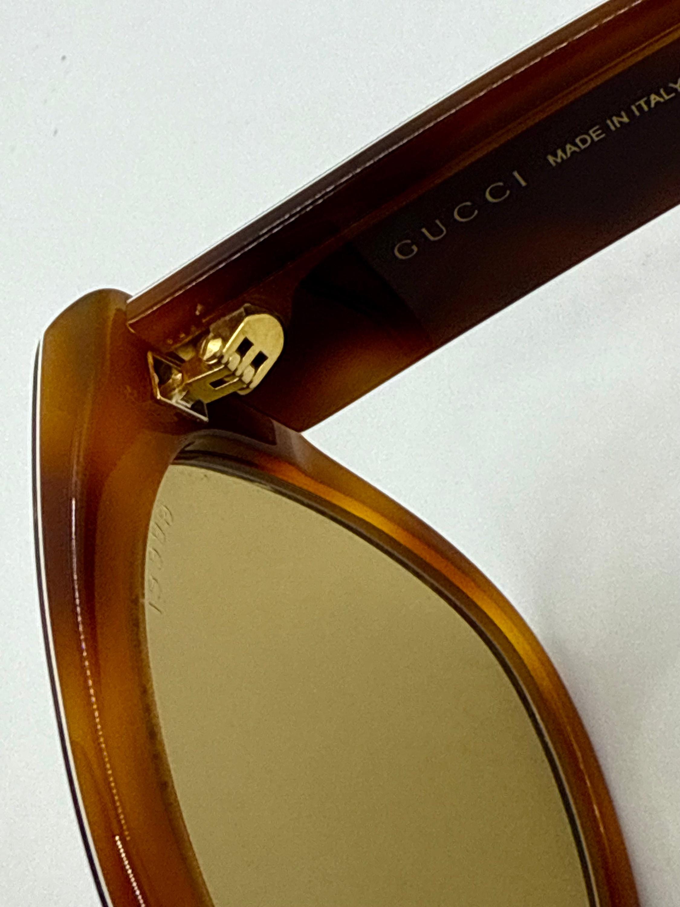 Gucci GG0059S 003 Cat Eye Sunglasses Tortoise Stripe Studded Arms Gucci Gg0059s 003 Amber Tortoise Geometric Sunglasses W  main image 2