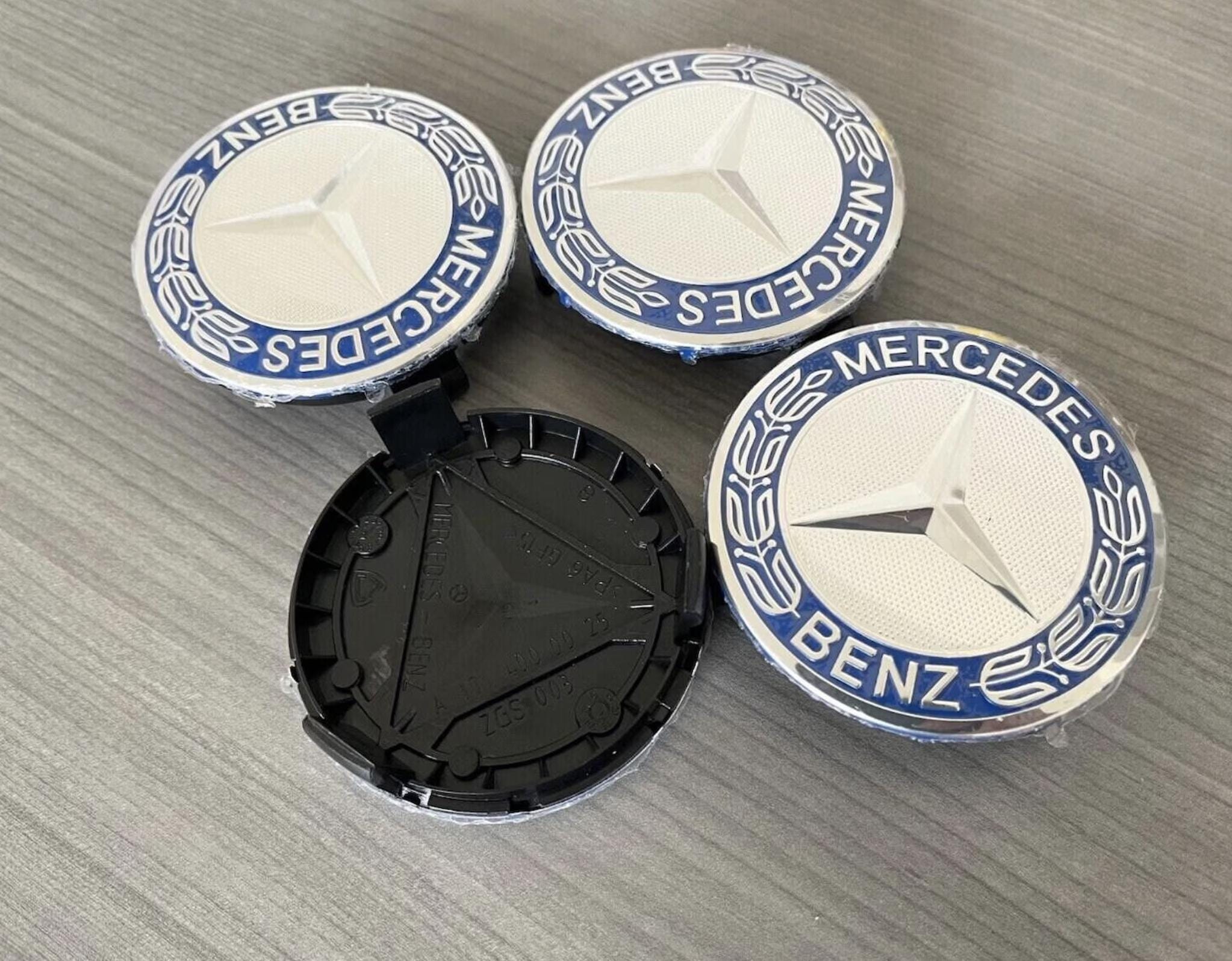 thumbnail image 2 of 4 Mercedes-Benz Wheel Hub Cover Caps – Blue Star Laurel Wreath, 75mm, OEM A1714000125 2 of 5
