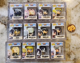 May include: Collection of Naruto Funko Pop! figures in clear protective cases. Characters include Kakashi Hatake, Sakura Haruno, Sasuke Uchiha, Naruto Uzumaki, Tenten, Madara Uchiha, Might Guy, Itachi Uchiha, Tsunade, Minato Namikaze, Orochimaru, and Jiraiya.