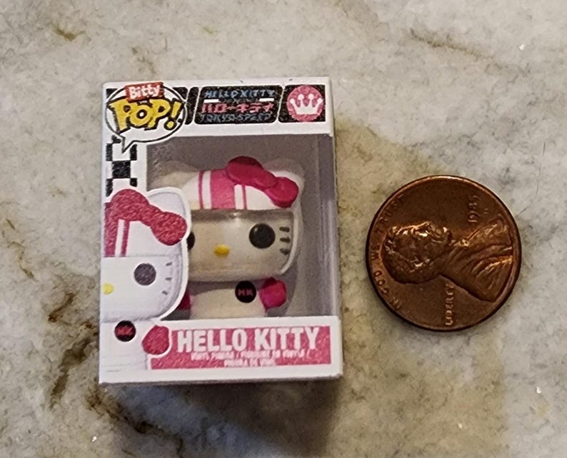 Funko Pop Bitty HELLO KITTY ~ Tú eliges Hello Kitty Driver