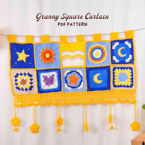 May include: A handmade, colorful granny square curtain with a variety of designs, including stars, suns, moons, and butterflies. The curtain is primarily blue, yellow, and white, with a decorative yellow border and hanging star-shaped accents. The text "Granny Square Curtain PDF Pattern" is visible.