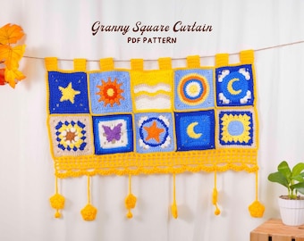 May include: A handmade, colorful granny square curtain with a variety of designs, including stars, suns, moons, and butterflies. The curtain is primarily blue, yellow, and white, with a decorative yellow border and hanging star-shaped accents. The text "Granny Square Curtain PDF Pattern" is visible.