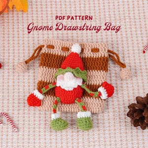 May include: A crocheted gnome drawstring bag with a red hat, beard, and mittens. The bag is beige and brown striped, with the text "PDF PATTERN Gnome Drawstring Bag". Decorative elements include candy canes, berries, and a pinecone.