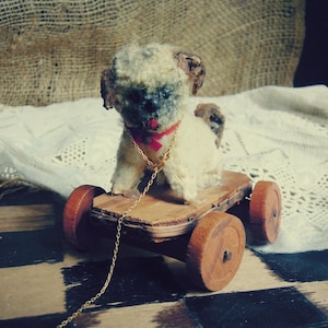 Vintage Steiff Pug Glass Button Eyes Wheel Miini Steiff Dog on Wood Wheels