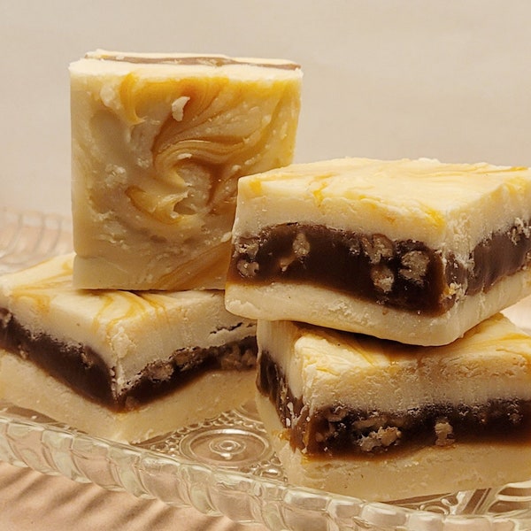 Vanilla Praline Fudge, Caramel and Pecans layered in vanilla fudge