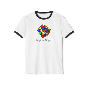May include: White t-shirt with black trim around the collar and sleeves. The shirt displays a colourful graphic of a Rubik's Cube and the text "Original Fidget" in a simple font.