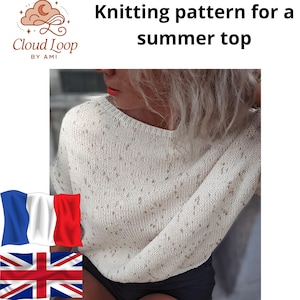 May include: Cream-colored knitted summer top with a textured pattern. The image features the text "Knitting pattern for a summer top" and the Cloud Loop by Ami logo. The top has a round neckline and short sleeves. The top is shown on a person.