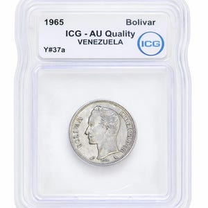 May include: A silver coin from 1965, encased in a clear plastic holder. The coin features a profile of a man and the words "BOLIVAR" and "LIBERTADOR". The holder has the text "ICG - AU Quality VENEZUELA".