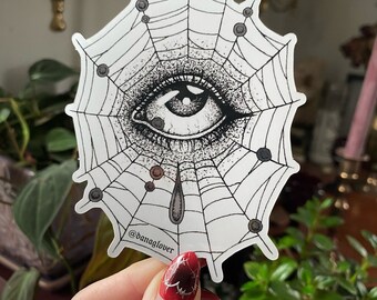 Spiderweb Lover’s Eye glossy vinyl sticker with silver metallic details