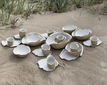 white ceramic set of plates bowls cups