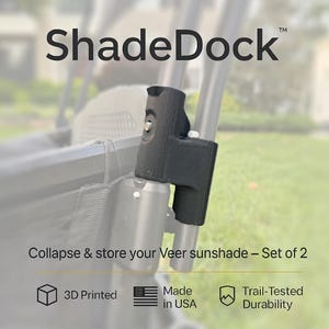 Peut inclure: Accessoire ShadeDock noir pour pare-soleil Veer. Le texte indique "ShadeDock" et "Collapse & store your Veer sunshade - Set of 2". Comprend impression 3D, Fabriqué aux États-Unis et Durabilité testée sur sentier.
