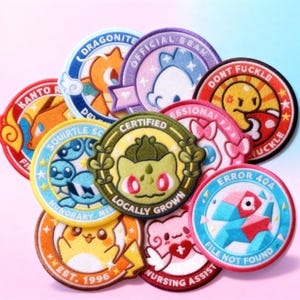 May include: A collection of embroidered patches with various designs and text. The patches feature cartoon characters and phrases like "Dragonite", "Squirtle Squad", "Certified", "Error 404", and "File Not Found". The patches are round with colorful borders.