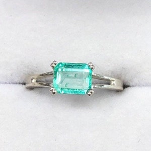 Zambian Elegance: 1.25 Carat Emerald Solitaire Silver Engagement Ring