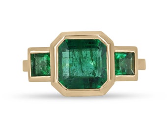 4.08tcw 14K Rich Green Asscher Cut Emerald Trilogy Three Stone Ring, Princess Cut Emerald Accent, Gold Bezel Set Emerald Right Hand Ring