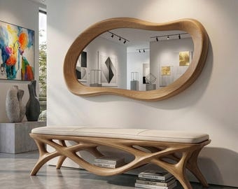May include: A wall-mounted mirror with an irregular, organic-shaped light wood frame and a long bench featuring a light wood base with an intricate, branching structure and a smooth, light-colored upholstered seat cushion.