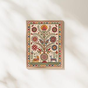 May include: A framed, colorful folk art print featuring a stylized tree with flowers, leaves, and animals. The artwork has a cream background with a decorative border of triangles and other shapes. The color palette includes red, yellow, blue, and green.