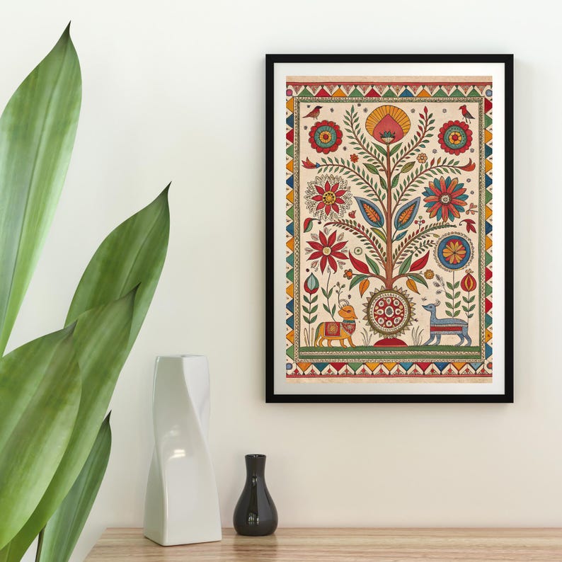May include: A framed, colorful folk art print featuring a tree with flowers, birds, and animals. The artwork has a cream-colored background and a black frame. The tree is the central focus, with red, blue, and yellow flowers.
